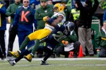Seattle's Jeremy Lane stops a Green Bay receiver.