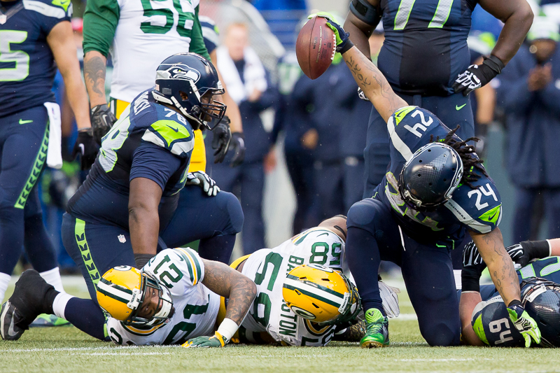Lynch spikes the ball after an explosive run.