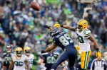 Seattle's Doug Baldwin is denied a pass by a Green Bay defender.