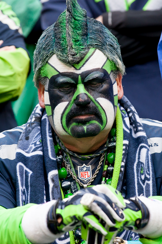  Russell Wilson holds up the NFC Championship trophy for all the 12s