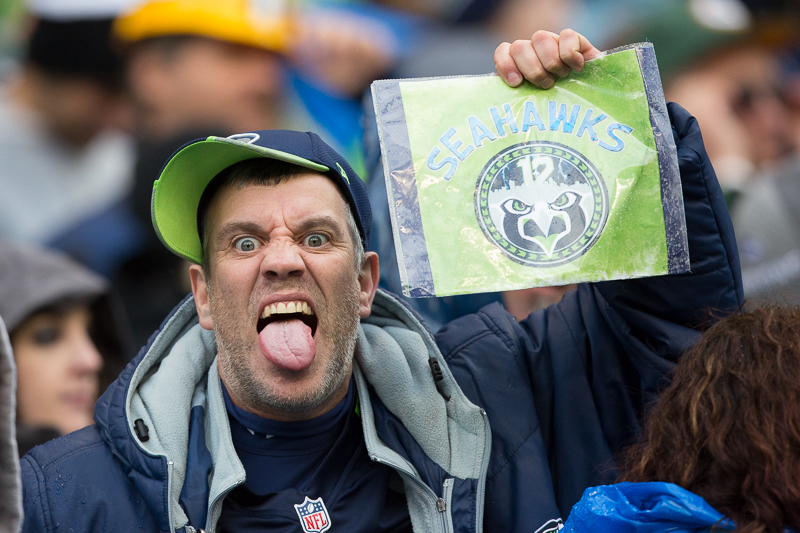  Russell Wilson holds up the NFC Championship trophy for all the 12s