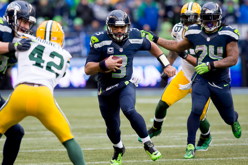 Russell WIlson scrambles hard for a 15-yard gain.