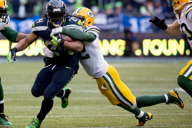 Marshawn Lynch rushes for a 3-yard gain.