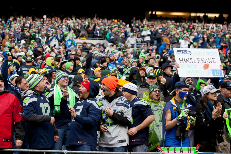  Russell Wilson holds up the NFC Championship trophy for all the 12s