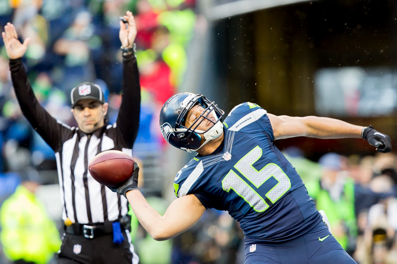 Jermaine Kearse spikes the ball after making the game-winning touchdown catch in overtime.