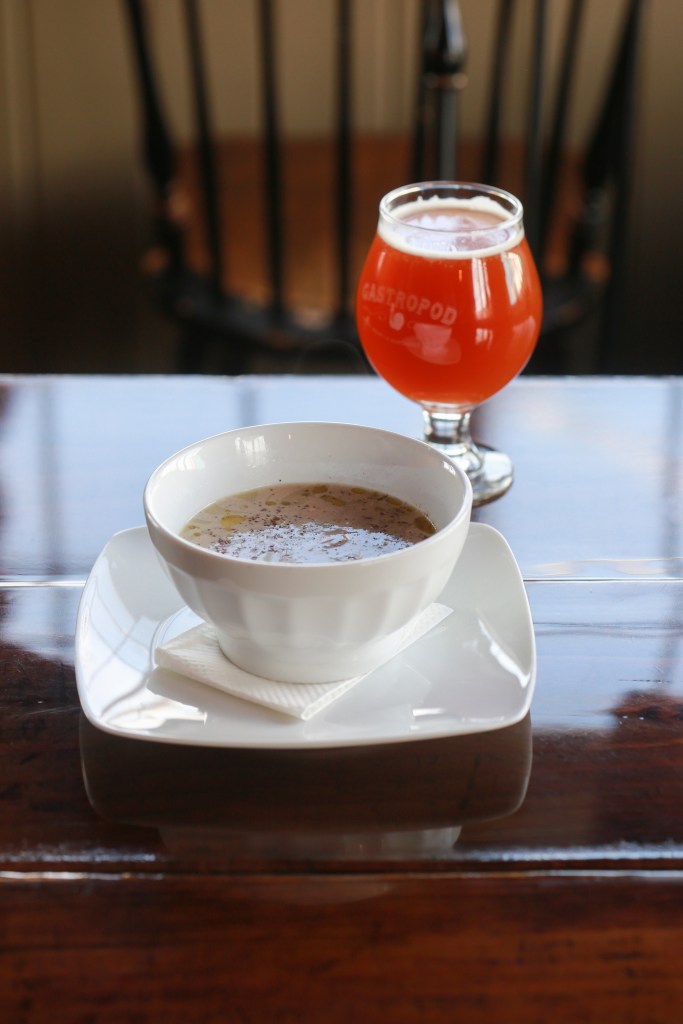 A beer and a bowl of green-banana soupat Epic/Gastropod.