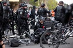Police pile onto a protester following a scuffle on Broadway that saw flash bangs, rubber bullets, and pepper spray fly.