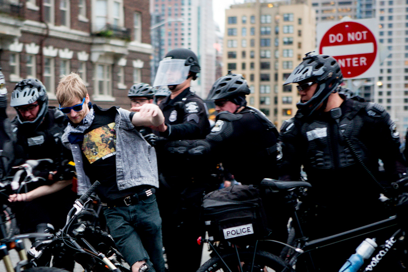 Police arrest a man that appeared to fail to move out of the way.