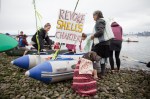 A group of protestors prepares to put into Elliot Bay.
