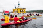 Kayaktivisits group around Shell's Polar Pioneer oil rig, moored at Terminal 5 at the mouth of the Duwammish River.