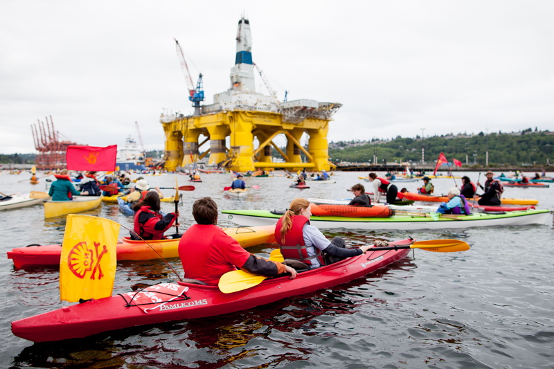 Kayaktivisits group around Shell's Polar Pioneer oil rig, moored at Terminal 5 at the mouth of the Duwammish River.