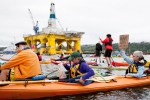 Kayaktivisits group around Shell's Polar Pioneer oil rig, moored at Terminal 5 at the mouth of the Duwammish River.