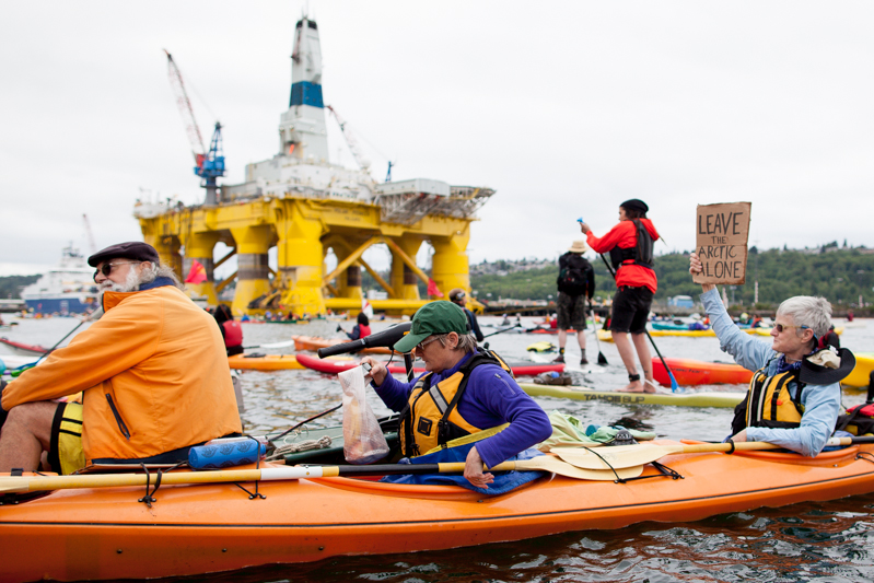 Kayaktivisits group around Shell's Polar Pioneer oil rig, moored at Terminal 5 at the mouth of the Duwammish River.