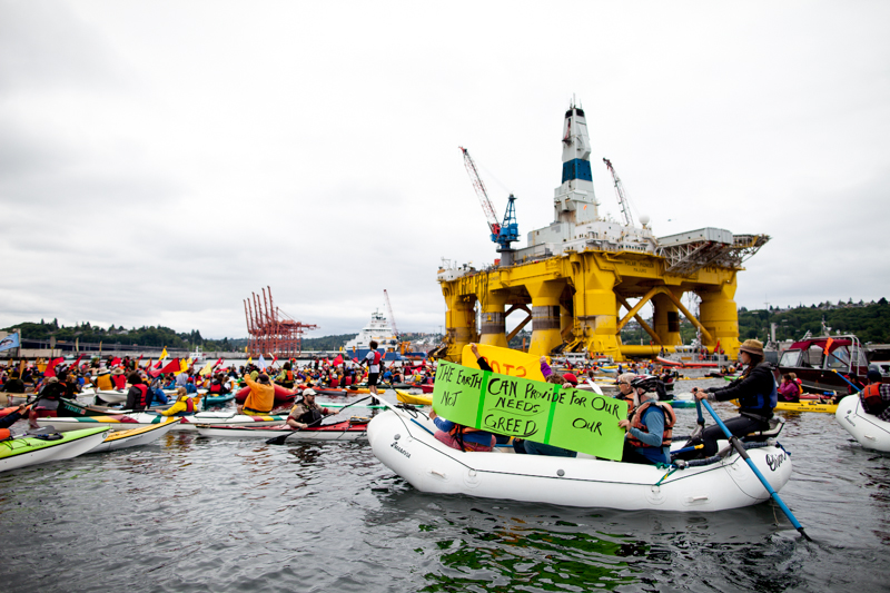 Kayaktivisits group around Shell's Polar Pioneer oil rig, moored at Terminal 5 at the mouth of the Duwammish River.
