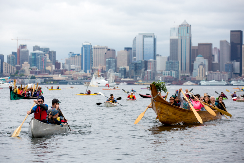 Hundreds of kayaktivists paddle back to shore following the waterborne demonstration.