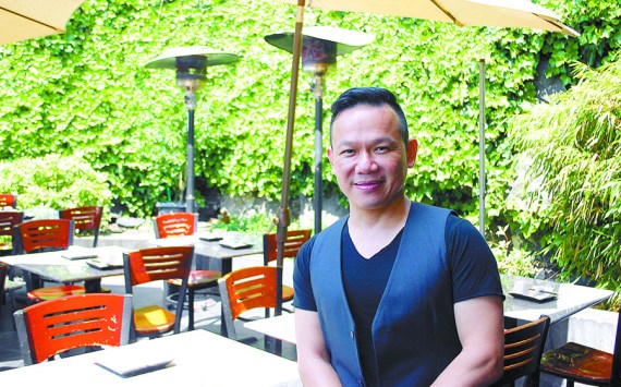 Tam Nguyen sits at his Tamarind Tree restaurant last week.