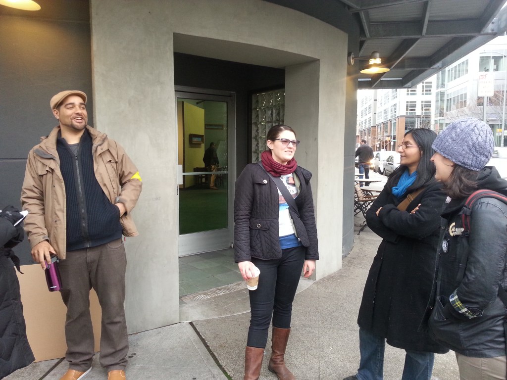 Teacher Jesse Hagopian (left) chats with city councilmember Kshama Sawant (second from right). Photo by Casey Jaywork.
