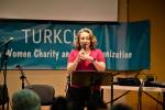 Tulin Yildiz speaks on the origin and significance of ashure in Turkish culture 
at Turkchas event at the Peter Kirk Community Center in Kirkland.                                 Photo courtesy of Dilek Anderson
