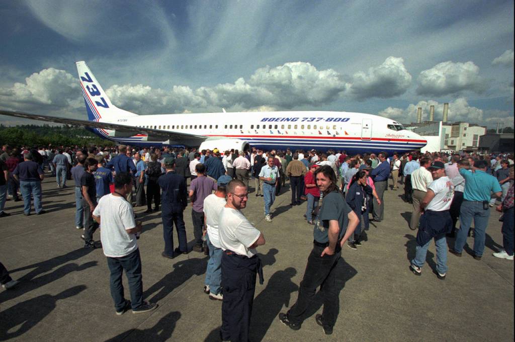 Boeing employees take a first look at Boeings next-generation 737-800 airplane at its debut in Renton on June 30, 1997. (AP Photo/Loren Callahan, file)