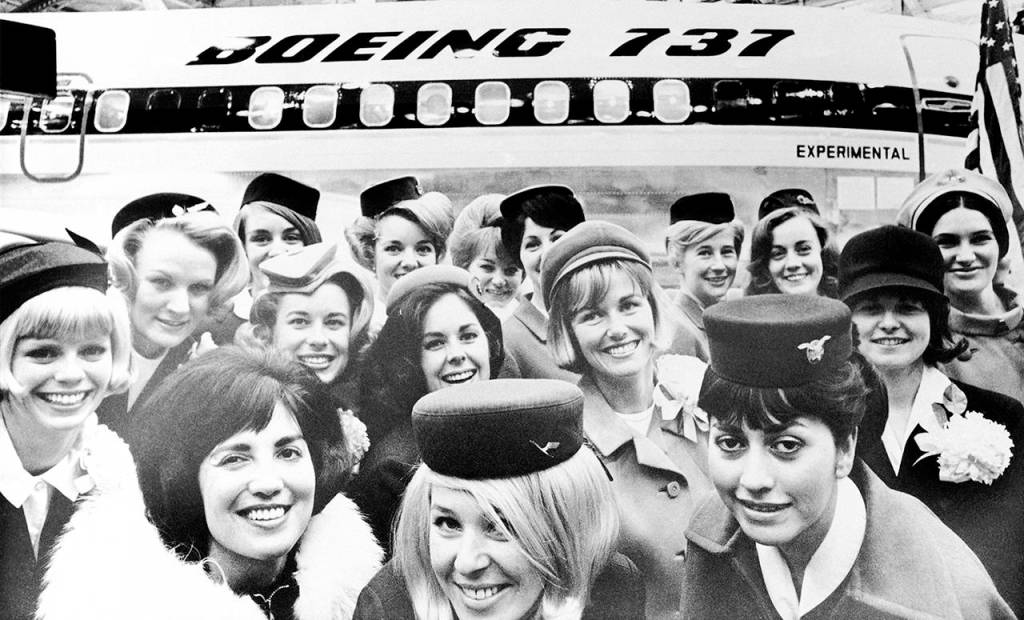 associated press file                                Stewardesses from the 15 airlines with orders for Boeing 737 jets pose in front of the first aircraft in a hanger in Seattle on Jan. 18, 1967. At the christening ceremony Boeing announced sales to two other airlines and 17 flight attendants all smashed bottles of champagne over the wing of the new aircraft.