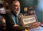 Don Ballard, the 2019 Evergreen Fair Honoree, talks about a fair logo cross-stitch piece he made at his home on Thursday, March 21, 2019 in Everett, Wash. (Olivia Vanni / The Herald)