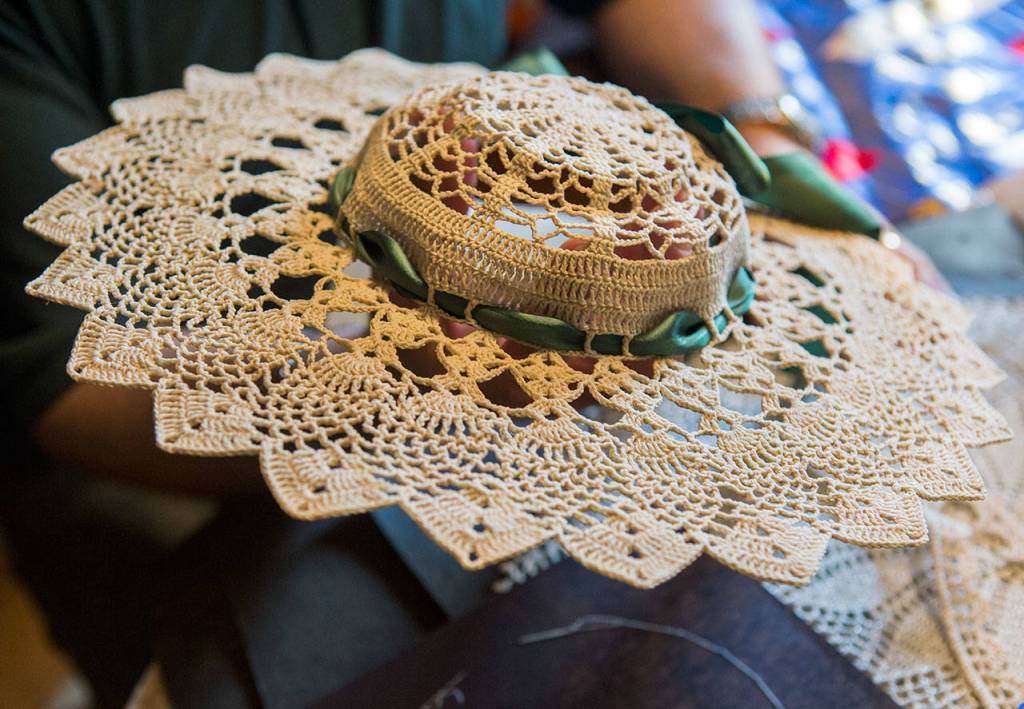 Don Ballard shows a crocheted doily that he made for the fair that was featured in The Daily Herald at his home on Thursday, March 21, 2019 in Everett, Wash. (Olivia Vanni / The Herald)