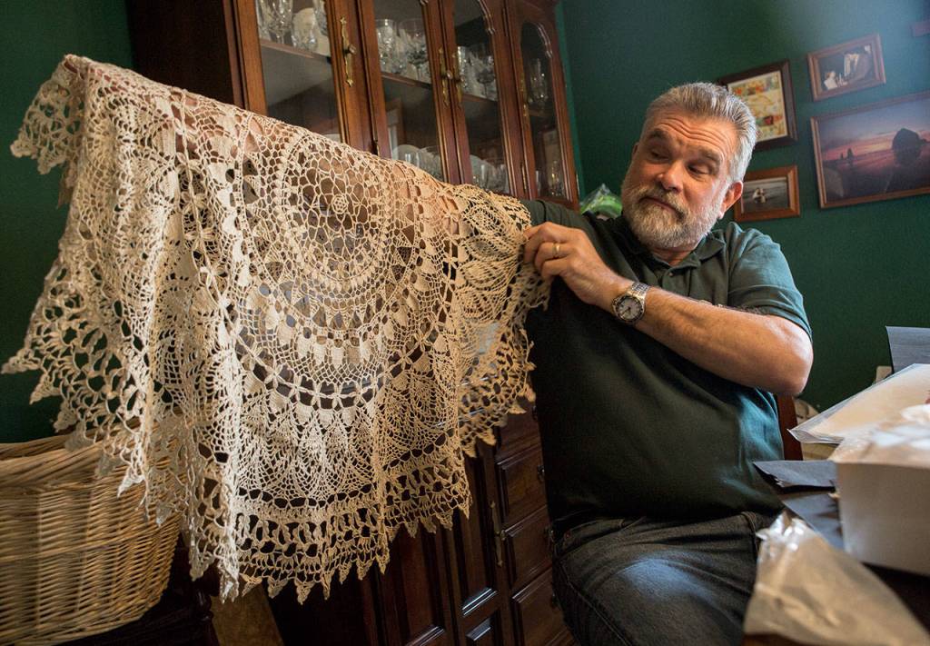 Don Ballard shows a crocheted doily that he made for the fair that was featured in The Daily Herald at his home on Thursday, March 21, 2019 in Everett, Wash. (Olivia Vanni / The Herald)