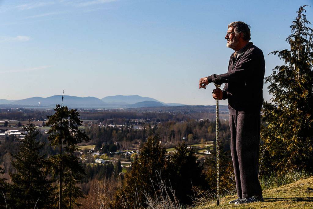 From his back yard, as well as throughout his home, Graham Kerr enjoys great views. He chose the Skagit Valley for its beauty and bounty. (Dan Bates / The Herald)