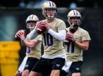 Washington quarterback Jacob Eason (10), a Lake Stevens alum, runs through position drills during spring practice on April 3, 2019, in Seattle. (Olivia Vanni / The Herald)