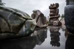 A sculpture is reflected off of a smooth surface at the Cloudstone outdoor gallery in Freeland. (Olivia Vanni / The Herald)