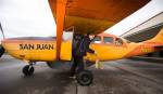 After loading passengers, San Juan Airlines pilot Rebecca Watson pulls chocks before piloting a Cessna 207 for an early morning flight to the San Juan Islands from Bellingham International Airport on Tuesday. The little airlinewill begin twice-daily scheduled flights from Everett to the San Juan Islands on May 1. (Andy Bronson / The Herald)