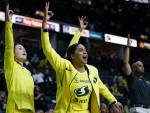 Seattles Recee Caldwell celebrates on the bench after a Storm teammate made a 3-pointer during a preseason game against Phoenix on Wednesday at Angel of the Winds Arena in Everett. (Olivia Vanni / The Herald)