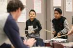 Jayven Nation (center) and Milson Lain follow Pat Jamesons lead during drum club practice at Challenger Elementary School in Everett. (Kevin Clark / The Herald)
