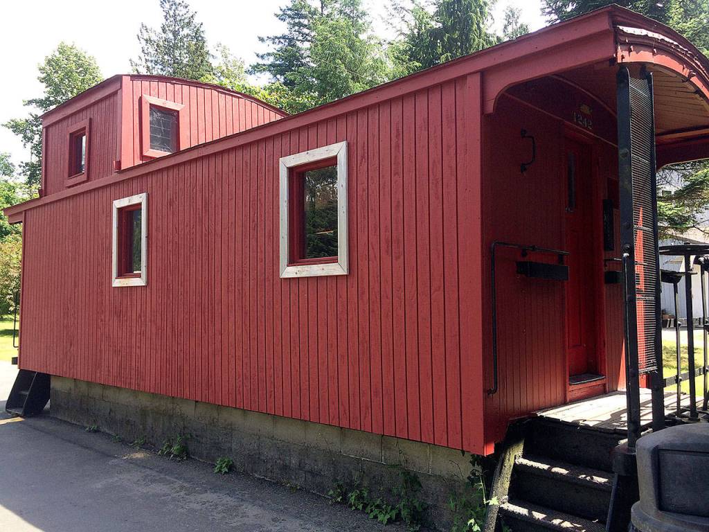 An old caboose sits next to Zekes Drive-In. The original owner, Earl Zeke Wells, bought it for customers to eat in. Today, its doors are shut. (Evan Thompson / The Herald)