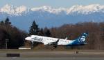 With the Olympic mountains in the background, the first Paine Field passenger flight by Alaska Airlines departs for Portland on March 4. Alaska has announced a ninth destination  Palm Springs, California. (Andy Bronson / The Herald)