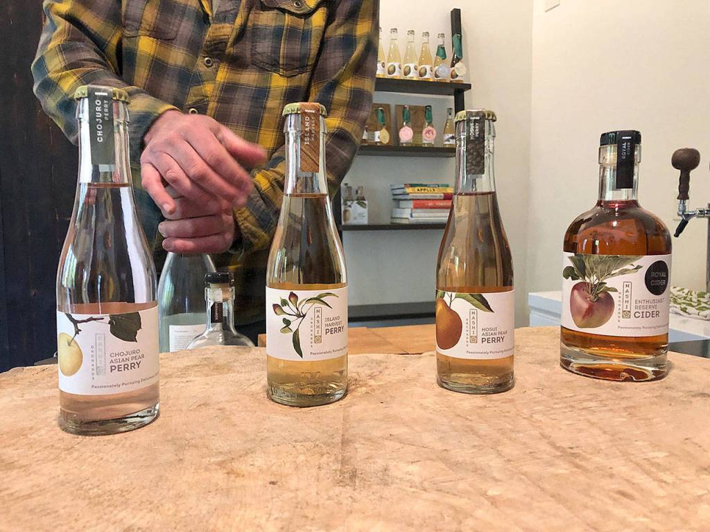 Nashi Orchards owner Jim Gerlach prepares a tasting flight at Nashi Orchards on Vashon Island. (Aaron Swaney)