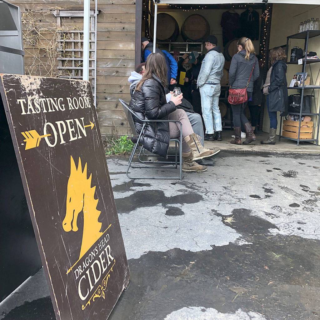Customers enjoy cider at Dragons Head Ciders tasting room on a recent weekend. Dragons Head Ciders tasting room is open Friday through Sunday. (Aaron Swaney)