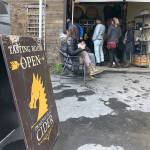 Customers enjoy cider at Dragons Head Ciders tasting room on a recent weekend. Dragons Head Ciders tasting room is open Friday through Sunday. (Aaron Swaney)