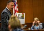 Deputy prosecutor Matt Baldock shows a photo of a paper coffee cup that was taken with William Talbott IIs DNA on it during the trial of William Talbott II at the Snohomish County Courthouse on Monday in Everett. (Olivia Vanni / The Herald)