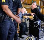 William Talbott II is helped to a wheel chair by Snohomish County Sheriffs after being found guilty Friday morning at the Snohomish County Court House in Everett on June 28, 2019. (Kevin Clark / The Herald)