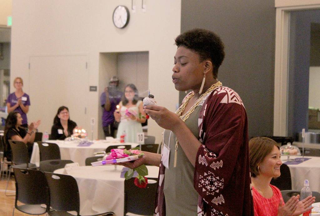 Kathie Nguyen blows out her birthday candle at Saturdays Celebrate 18! event. OLIVIA SULLIVAN, Federal Way Mirror