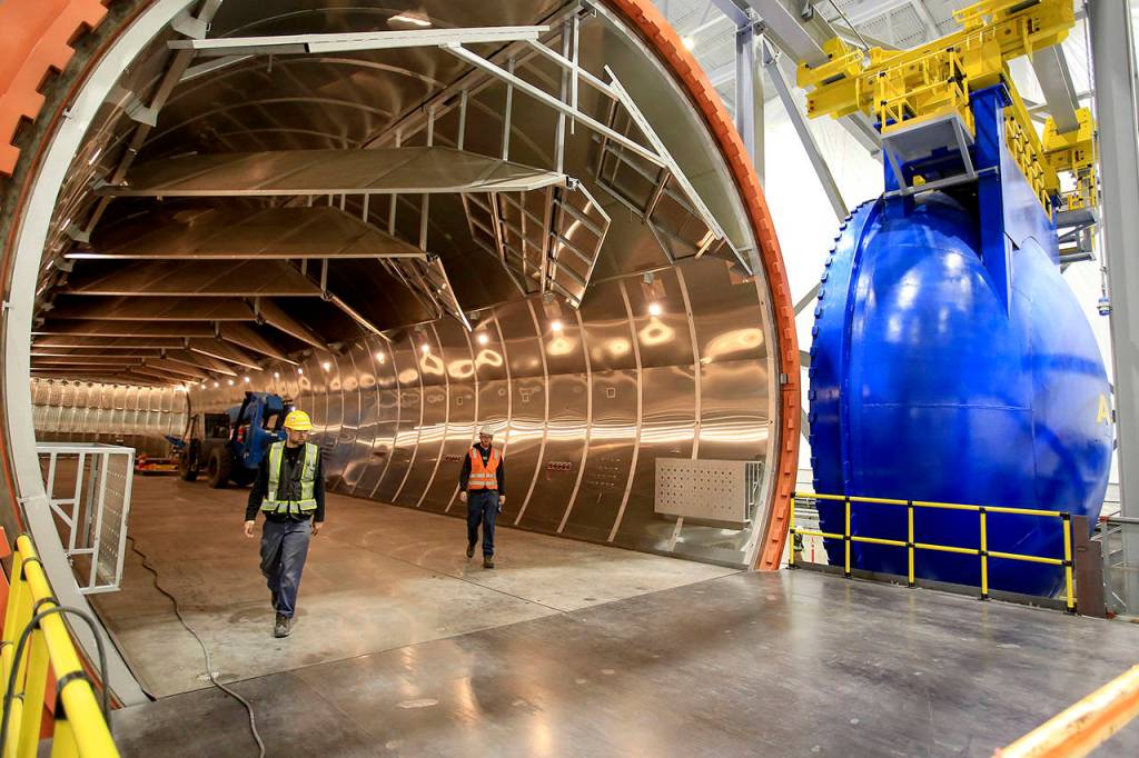 Crews walk the autoclave at the new 777x Composite Wing Center at Paine Field in Everett on May 19, 2016. (Kevin Clark / Herald file)