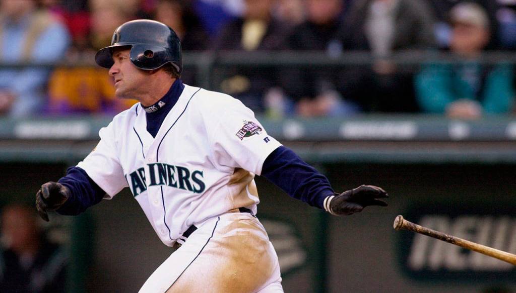 The Mariners Edgar Martinez drops his bat as he heads toward first on a two-run double against the Athletics on April 4, 2001, in Seattle. (Elaine Thompson / AP Photo)