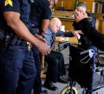William Talbott II is helped to a wheelchair by Snohomish County Sheriffs Deputies after being found guilty on June 28 in the 1987 killings of Tanya Van Cuylenborg and Jay Cook. Jurors deliberated for more than two days before reaching their verdict in the trial that hinged on 32-year-old DNA evidence and genealogical technology. (Kevin Clark/The Herald via AP, Pool file)
