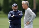 Seahawks head coach Pete Carroll (right) talks with general manager John Schneider following an organized team activity on June 6, 2019, in Renton. (AP Photo/Ted S. Warren)