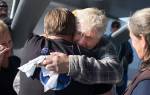John Norman hugs Jeff Sandstorm after Normans replica of the Spirit of St. Louis finished its first flight from Arlington Municipal Airport on July 28. Sandstorms brother Ty was instrumental in getting the exacting details of the plane, but passed away before the flight happened. (Andy Bronson / The Herald)