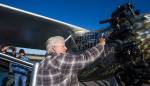 John Normans grabs hold of a cold exhaust pipe after the first flight of his replica airplane, the Spirit of St. Louis, from Arlington Municipal Airport on July 28. A couple cylinders on the engine misfired and were cold at the end of the flight, meaning hell have figure out why they did not work. (Andy Bronson / The Herald)