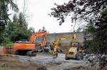 Heavy equipment is parked in former residential lots along I-5 in preparation for the light extension to Lynnwood slated to be completed in 2024. (Kevin Clark / The Herald)