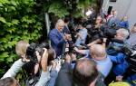 Gov. Jay Inslee is surrounded by reporters as he speaks about his plans to run for a third term as governor Thursday in Seattle. (AP Photo/Elaine Thompson)