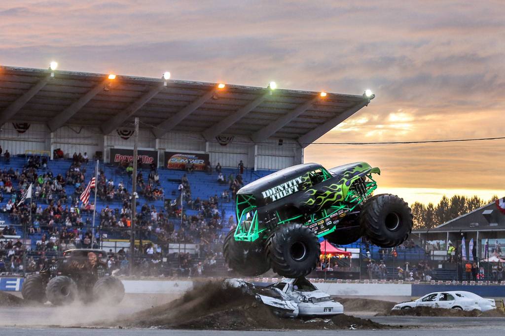 Identity Theft, driven by Marvin Anderson, jumps an obstacle Friday evening during the Evergreen State Fair at the Evergreen Speedway in Monroe. (Kevin Clark / The Herald)